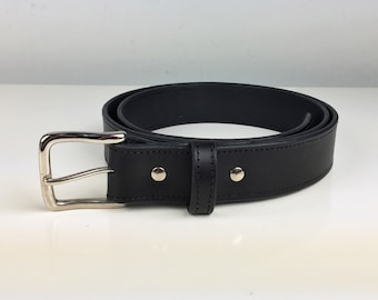 May include: A black leather belt with a silver buckle. The belt has two silver rivets on the strap.