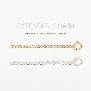 May include: Two extender chains, one gold filled and one sterling silver. Both chains are made of small, linked circles.