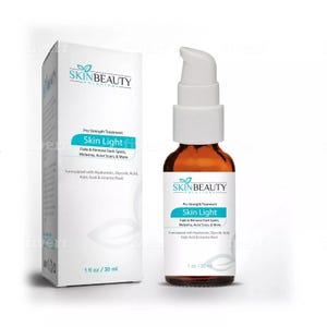 May include: A white box and a brown glass bottle with a white pump top. Both containers feature a green leaf logo and the text "SKINBEAUTY SOLUTIONS". The text "Pro Strength Treatment Skin Light" is on both containers. The text "Fade & Remove Dark Spots, Melasma, Acne Scars, & More" is on both containers. The text "Formulated with Hyaluronic, Glycolic Acid, Kojic Acid & Licorice Root" is on both containers. The box has the text "1 fl oz / 30 ml". The bottle has the text "1 oz / 30 ml".