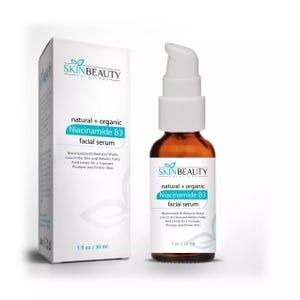 May include: A 30 ml bottle of Skin Beauty Solutions natural and organic Niacinamide B3 facial serum. The bottle is amber glass with a white pump top. The label is white with blue and green text. The text on the label reads "natural + organic Niacinamide B3 facial serum". Niacinamide B3 reduces water loss in the skin and retains fatty acid levels for a younger, plumper and firmer skin.