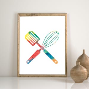 May include: A watercolor print of a spatula and whisk crossed over each other. The utensils are painted in shades of red, orange, yellow, green, and blue.