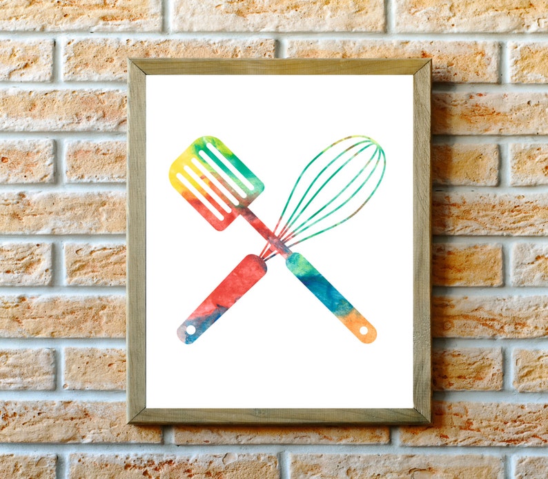 May include: A watercolor illustration of a spatula and whisk crossed over each other. The spatula and whisk are painted in shades of red, orange, yellow, green, and blue.