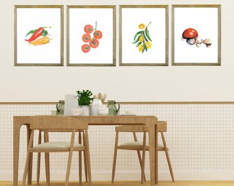 May include: Four framed watercolor prints of food items: chili peppers, tomatoes, olives, and mushrooms. The prints are in wooden frames and hang above a wooden table and chairs. The artwork adds a touch of nature to the dining area.
