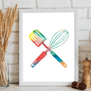 May include: A watercolor print of a spatula and whisk crossed over each other. The utensils are painted in a rainbow of colors, including red, orange, yellow, green, blue, and purple.