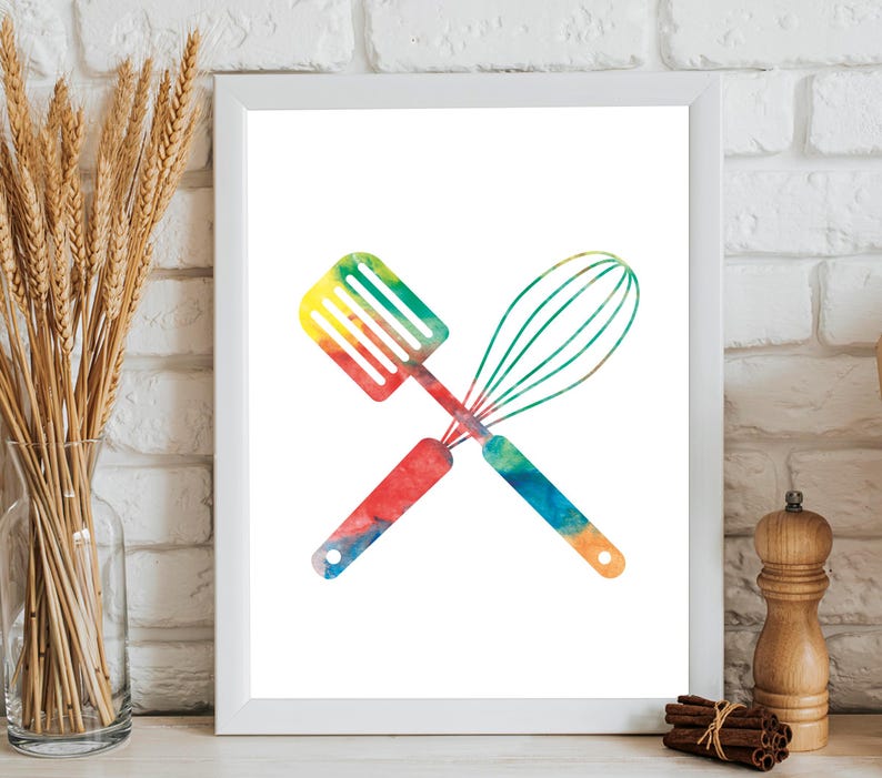 May include: A watercolor print of a spatula and whisk crossed over each other. The utensils are painted in a rainbow of colors, including red, orange, yellow, green, blue, and purple.