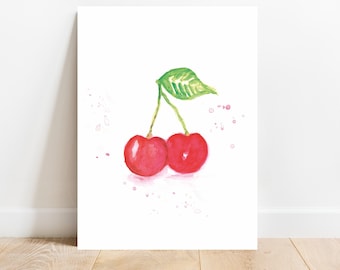 Könnte beinhalten: Ein Aquarellbild von zwei roten Kirschen mit einem grünen Blatt auf weißem Hintergrund mit rosa Aquarellspritzer.