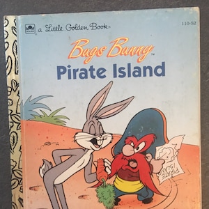 May include: A Little Golden Book featuring Bugs Bunny and a pirate on a desert island. The book cover is yellow with a gold border and the title "Bugs Bunny Pirate Island" is in red and white.