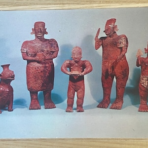 May include: Five terracotta figurines, including a dog, a woman, a man, and two children. The figurines are all standing upright and have a reddish-brown color.