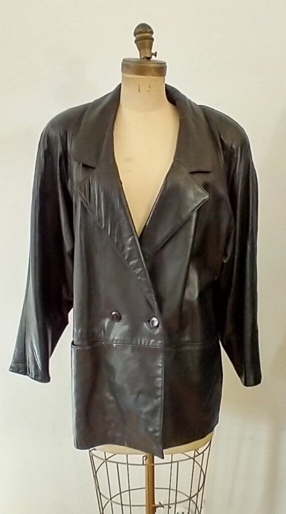 Vintage women's leather coat with shoulder pads