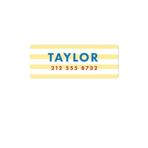 May include: Yellow and white striped label with the name "TAYLOR" in blue text and the phone number "212 555 8732" in red text.