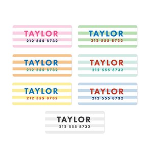 May include: Set of six colorful striped labels with the name "TAYLOR" and phone number "212 555 8732" printed on each label.