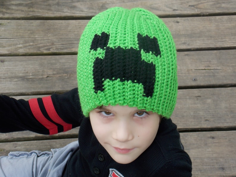 Green and Black Pixeled Creature 
