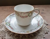 T V LIMOGES France - Demitasse Cup and Saucer - Pattern 5511 Ink Stamped is Ca. 1907-1919 Gold Trim w Wreaths and Pink Draped Flowers.