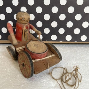 Vintage Hand Made Asian Toy Man On Wheeled Platform Playing Drum w Pull String Collectible Toys