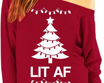 May include: Red off-the-shoulder sweater with a white Christmas tree and the text "LIT AF" printed on it. The tree has white lights and a star on top.