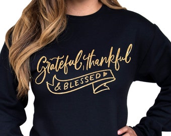 May include: Black sweatshirt with gold glitter lettering that reads "Grateful, Thankful & Blessed".