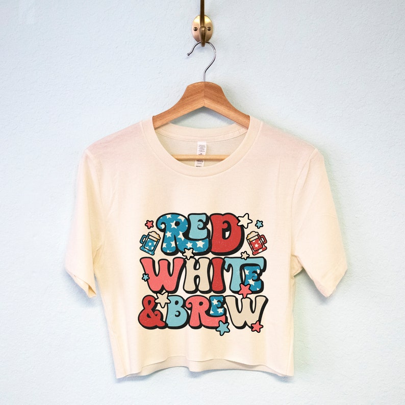 May include: A white cropped t-shirt with a red, white, and blue graphic that says "Red White & Brew" with stars and beer mugs.