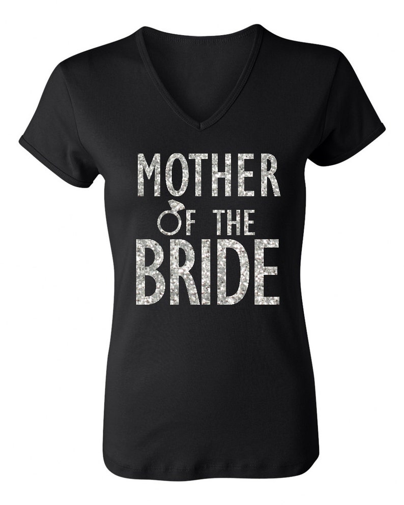 May include: Black v-neck t-shirt with silver glitter text that reads "Mother of the Bride".
