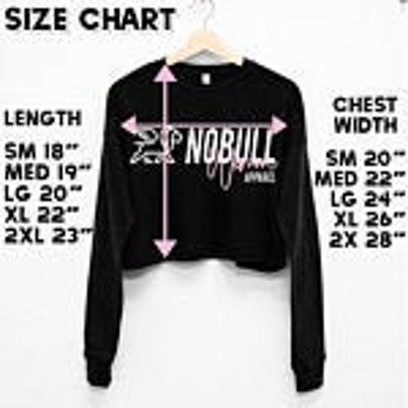 May include: Size chart for a black long-sleeve cropped shirt with the text "NOBULL" printed on the front. The chart shows measurements in inches for length and chest width in sizes small, medium, large, extra large, and 2 extra large.