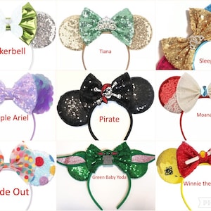 May include: Nine pairs of colorful Disney character-themed Minnie Mouse ears with bows. The ears are made of sequins, fabric, and other materials. The characters include Tinkerbell, Tiana, Sleeping Beauty, Purple Ariel, Pirate, Moana, Green Baby Yoda, Winnie the Pooh, and Inside Out.