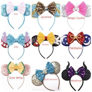 May include: Ten pairs of colorful Disney-themed mouse ears with bows and embellishments. The ears are on headbands. The names of each pair are written below: Elsa, Jasmine, Magic Castle, Lilo, Mickey, Fantasia, Dole Whip, Gold Jasmine, Maleficent.
