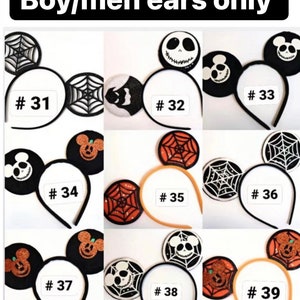May include: Nine pairs of Halloween-themed mouse ears with different designs, including a spiderweb, a pumpkin, and a skull. Each pair is numbered 31 through 39.