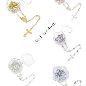 May include: Assortment of rosaries with 4mm beads in various colors, including gold, pink, purple, silver, and blue. Each rosary is displayed in a clear, flower-shaped container. The text "Bead size 4mm" is visible.