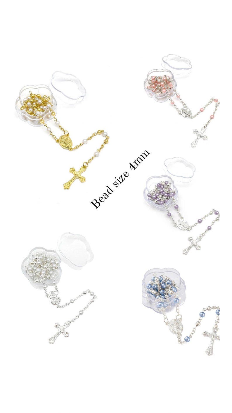 May include: Assortment of rosaries with 4mm beads in various colors, including gold, pink, purple, silver, and blue. Each rosary is displayed in a clear, flower-shaped container. The text "Bead size 4mm" is visible.