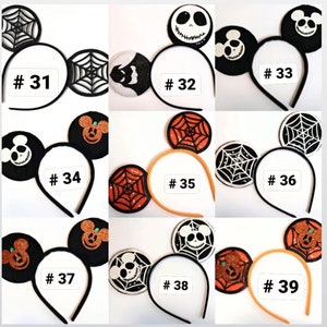 May include: Nine different Halloween-themed headband styles with various designs, including Mickey Mouse, Jack Skellington, and spiderwebs. The headbands are black, orange, and white.