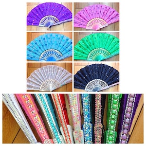 May include: A collection of six folding hand fans in purple, pink, light blue, green, white, and dark blue, each featuring sequins and a decorative frame. Below, eight closed fans are displayed, showcasing intricate rhinestone and bead embellishments.