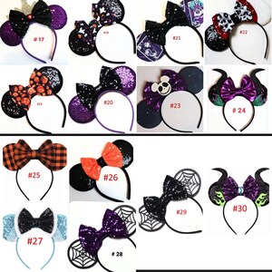 May include: A set of 30 Halloween-themed mouse ears headbands. The headbands are decorated with various Halloween characters and designs, including pumpkins, ghosts, spiders, and bats. The headbands are made of black felt and have a purple, orange, or black bow.