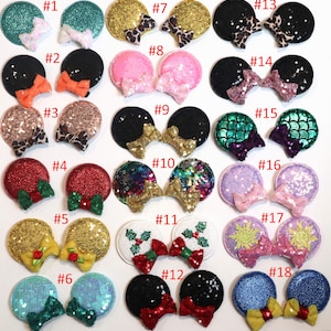 Puede incluir: Una colecci&oacute;n de dieciocho pares de diademas decorativas con orejas de rat&oacute;n. Las orejas presentan varios colores, patrones y adornos, incluyendo purpurina, lentejuelas y lazos. Los dise&ntilde;os incluyen estampado de leopardo y temas festivos.