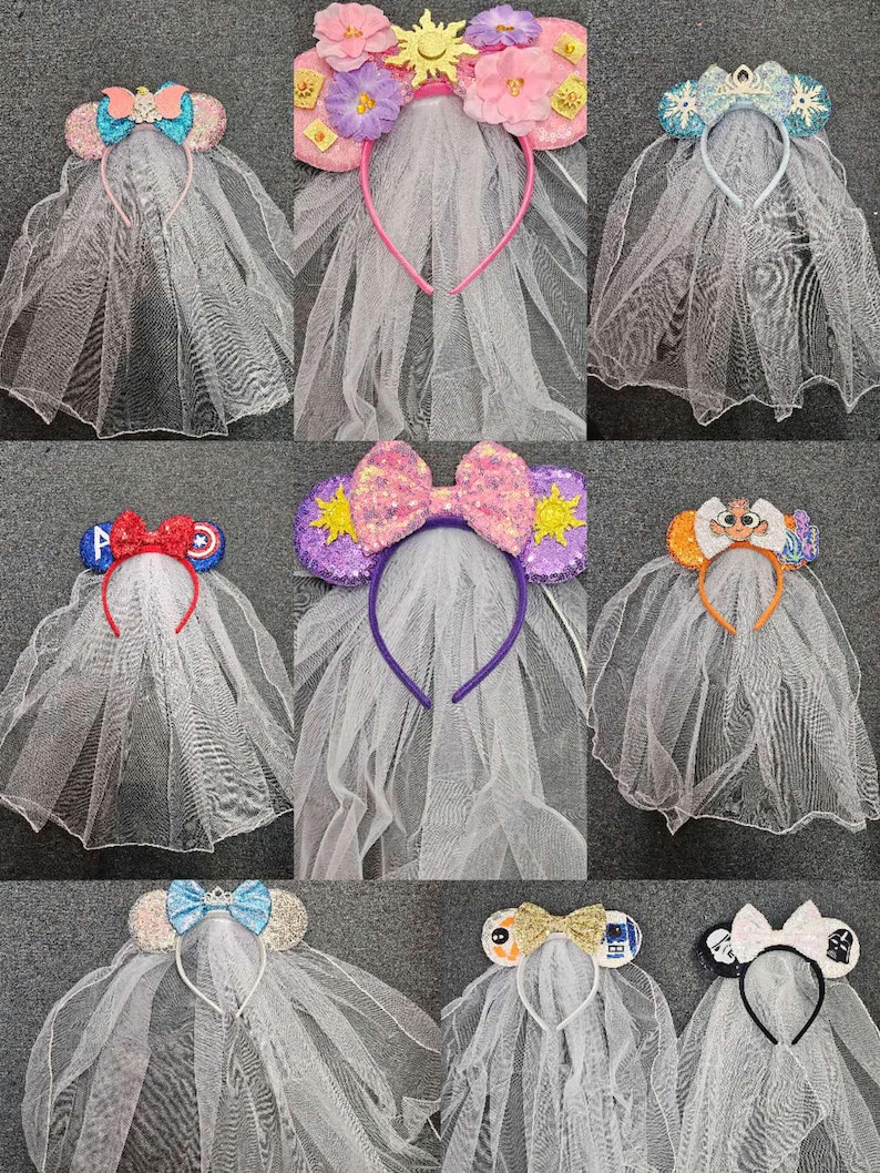 May include: A set of ten white tulle veils with various character-themed headbands. The headbands feature different Disney characters, including Mickey Mouse, Minnie Mouse, princesses, and superheroes. The veils are attached to the headbands and are made of a soft, sheer fabric.