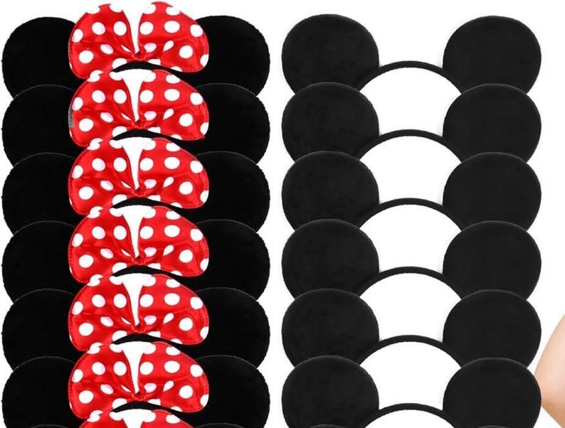 May include: Black mouse ear headbands with red and white polka dot bows. The ears are made of a soft, plush material. The bows are a bright red with white polka dots. The headbands are a classic accessory for themed events.