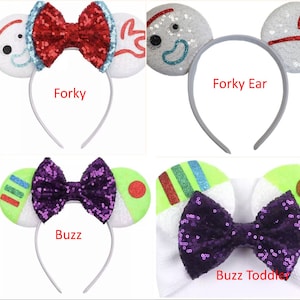 May include: A collection of Toy Story themed character headbands and hair clips. The headbands feature characters like Buzz Lightyear, Forky, and Bo Peep. The hair clips feature Buzz Lightyear and Alien.