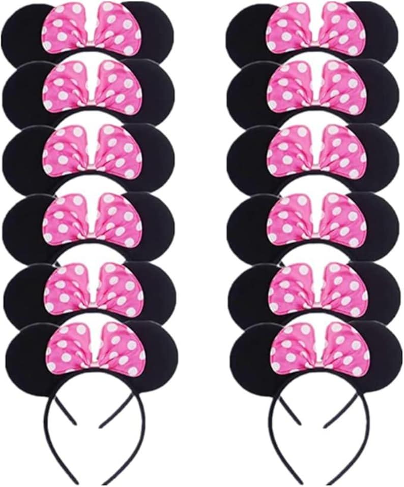 May include: Black mouse ear headbands with pink polka dot bows. The ears are round and the bows are a bright pink with white polka dots. The headbands are black and made of a flexible material. The image shows multiple headbands.