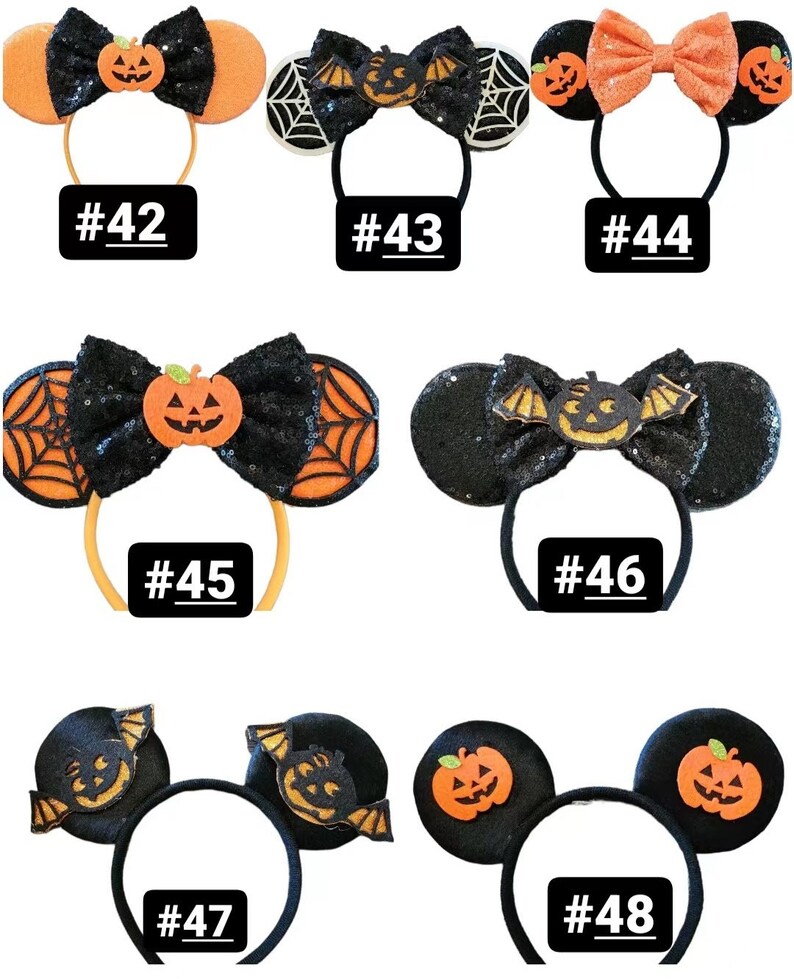 May include: Eight pairs of Halloween-themed Minnie Mouse ears. Each pair features a different design, including pumpkins, bats, and spiderwebs. The ears are black with orange and white accents. The numbers 42 through 48 are printed below each pair of ears.