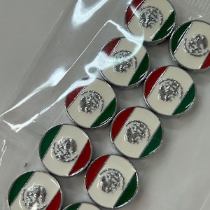 May include: A set of ten circular metal buttons, each featuring the Mexican flag design with a white center, green and red side stripes, and a silver-toned embossed eagle emblem in the middle, all enclosed within a clear plastic storage bag.
