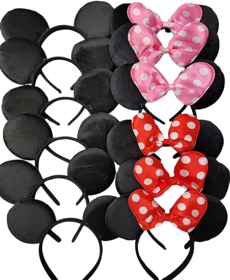 May include: A collection of black mouse ear headbands with attached bows. The bows are either pink with white polka dots or red with white polka dots. The headbands are black and the ears are round and plush.