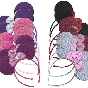 May include: A collection of headbands with large, round ears and sequined bows. The headbands come in various colors, including purple, pink, silver, and black. The ears are covered in glittery fabric.