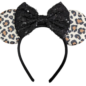 May include: Leopard print mouse ears headband with a black sequined bow.