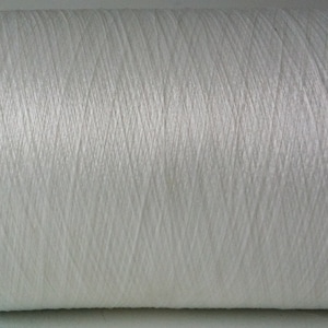 May include: A white spool of thread.