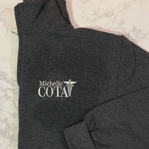 COTA Quarter Zip Sweatshirt, Personalized Custom Certified Occupational Therapy Assistant Medical Jacket, Graduation Gift For Men & Women