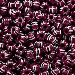 May include: A large pile of burgundy and white striped plastic beads. The beads are round and have a hole in the center.