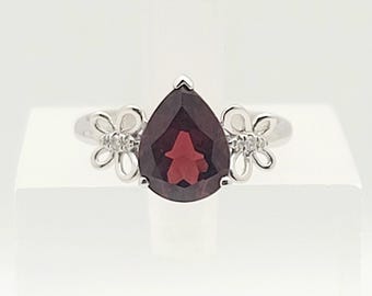 18kt white gold diamond and pear shaped Garnet ring.