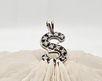14kt white gold diamond S pendant.