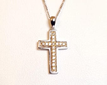 14kt white gold diamond cross pendant.
