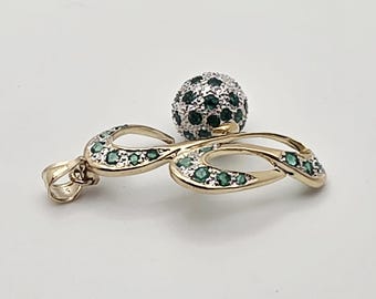 14kt yellow gold diamond and emerald pendant.