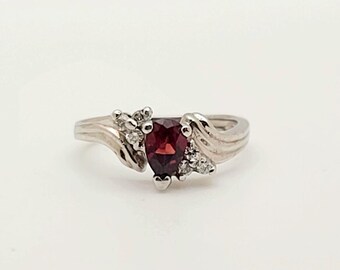 14kt white gold diamond and pear shaped Garnet ring.