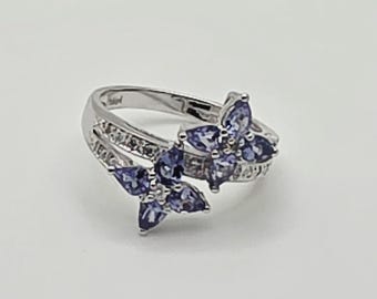 14kt white gold diamond and tanzanite cluster ring.